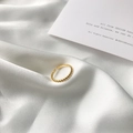 Elegant gold twisted S925 silver ring with black zircon and pearl on white silk fabric - Twist Style Ring (K288)