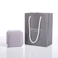 Close-up of a premium grey velvet jewelry box and matching gift bag for jewelry storage - Grey Gift Bag