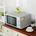 Linen microwave dust cover with grey geometric triangle patterns and white pom-poms - Microwave Style / Grey Triangle