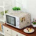 Beige cotton linen microwave dust cover with vintage stamp print and white pom-pom fringe - Universal Microwave / JIS Letter