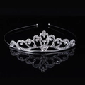Silver alloy princess crown headband with clear rhinestones on a black reflective surface - Size 8