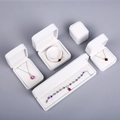 Collection of white velvet jewelry boxes for necklaces, bracelets and rings in top view - Small Ring & Earring Box (G) / Off White