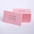 Pink silver polishing cloth for jewelry care shown in professional studio lighting - Pink Polishing Cloth