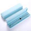 Light blue velvet jewelry box with silver bracelet featuring a black clover charm - 21.5*5.5*2.6 Long Chain Box