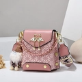 Pink crossbody bag with diamond patterns, swan metal clasp, and plush doll charm decor - Pink