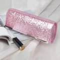 Pink sequin evening clutch bag with metallic trim on elegant white silk background - Pink