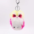 Detail of colorful faux fur owl keychain with silver metal clasp and soft plush texture - Yellow