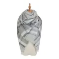 Grey and white plaid oversized cashmere-feel scarf with fringe on a mannequin - A75 Classic Grey White Plaid