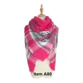 Pink and grey checkered cashmere-like scarf with tassels on a mannequin model - A80 Pink Grey White Plaid
