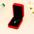 Red velvet rectangular necklace gift box with silver pendant shown in a lifestyle setting - Large Pendant Box / Red