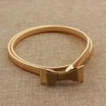 Elastic gold metal waist belt for women with a stylish bow buckle and leaf motif - Gold Bow with Brown Decoration