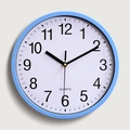 Minimalist 10-inch light blue round plastic wall clock with white quartz dial - Blue