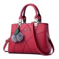 Fashionable red lychee pattern leather handbag for women with plush ball charm - Burgundy