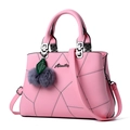 Pink lychee leather handbag for women with geometric stitching and fur ball charm - Pink