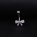 Polished stainless steel belly button ring with a sparkling crystal bow on black leather - White