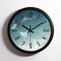 Modern silent wall clock with a teal gradient geometric dial and black metal frame - Black