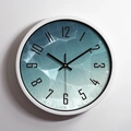 Modern silent aluminum wall clock with teal geometric low-poly pattern dial and black digits - White