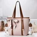 Pale pink bucket bag with wide ethnic strap and silk scarf detail for elegant women - Pink