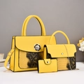 Detailed close-up of yellow 3-piece handbag set with crocodile pattern and metal floral lock - Yellow