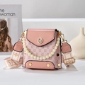 Pink monogram shoulder bag with pearl handle and wide clover strap on a white stand - Pink (Style 2: Monogram)