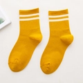 Yellow cotton crew socks featuring two white athletic stripes and ribbed knit texture - One Size / Yellow