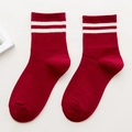 Red cotton crew socks with white double stripes on a clean white background - One Size / Red