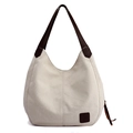 Beige canvas tote bag with contrast brown straps and high capacity Hobo style design - White