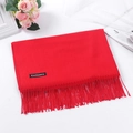 Solid red cashmere scarf for winter with elegant fringe details on white background - Red