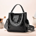 Elegant black patent leather bucket bag with wide geometric strap and quilted pattern - Fine Textured Lattice Style (Style 5)