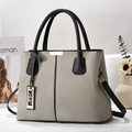 Elegante tweekleurige grijs-zwarte leren handtas met gouden hardware voor dames - Grijs Color-block