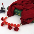 Detail of red chiffon scarf necklace with floral fabric pendant and faceted red beads - Red