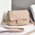 Detail of beige quilted shoulder bag featuring gold twist-lock and fine PU leather texture - Khaki