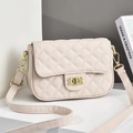 Beige quilted crossbody bag with golden twist lock on a minimalist white platform - Off White