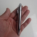 Polished silver metal ballpoint pen with twist mechanism held in hand for scale - Metallic Thick Pen
