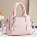 Pink lychee grain leather handbag for women featuring silver hardware and star pendant - Pink