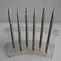 Set of 6 silver metal ballpoint pens with gold clips on clear acrylic display stand - Pencil Shape