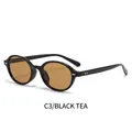 Occhiali da sole ovali retrò con montatura nera e lenti color tè ambrato stile Y2K - Montatura Nera Lenti Tè