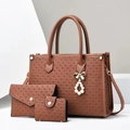 Detailed macro view of woven leather texture on a 3-piece brown tote bag set for women - Brown