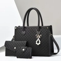 Close-up of three-piece black woven tote bag set with elegant pearl and bow charms - Black