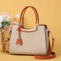 Women's handbag in beige and caramel with crocodile embossing and golden metal handles - Khaki