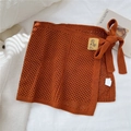 Détails de la jupe portefeuille en tricot orange caramel avec crochet et nœud latéral - Taille unique / Orange
