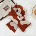 Vista dettagliata della sciarpa in 100% lana con trama in maglia jacquard arancione di qualità - 21*85cm / Arancio Floreale