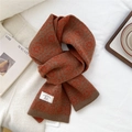 Detail of 100% wool knitted scarf with geometric patterns and white brand label - 21*160cm / Orange