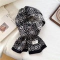 Detail of wool knit scarf featuring Nordic snowflake patterns and authentic wool label - 21*160cm / Snow Black