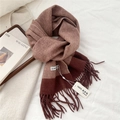 Close-up of 100% lamb wool scarf with classic herringbone pattern and soft fringe tassels - 31x183cm / Caramel color