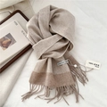 Detail of herringbone weave and fringe on a thick beige lambswool winter scarf - 31x183cm / Coffee