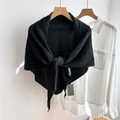 Detail shot of the thick knitted texture and dark gray wool fabric of the triangle scarf - Marled Black (03Ocio)
