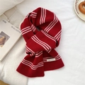 Detailed macro view of 100% wool label on classic red and white striped knit scarf - Thin Striped Style / 19*155cm / Red