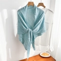 Close-up of light blue knitted shawl with intricate openwork geometric patterns - Light Blue