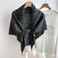 Close-up of black and white melange wool knit triangle shawl with front tie detail - 105x105x173cm / Marled Black-Beige
